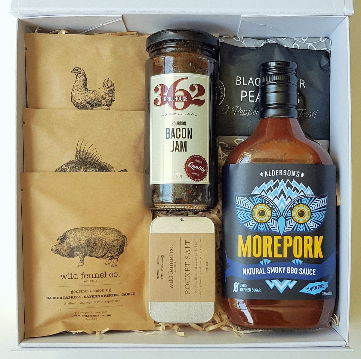 Boxsmith Food Gift Box featuring wild fennel seasonings, aldersons morepork sauce, wild fennel pocket salt, 362 wild south bourbon bacon jam & herb and spice black pepper peanuts. Easy NZ wide delivery of our online NZ food gifts